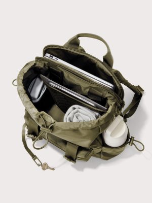 dagne-2025-Travel_Brooklyn_DarkMoss_Topdown_Accessories.jpg